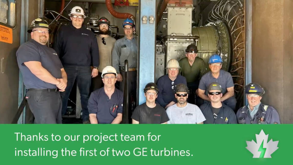 Group photo of project team with the written caption: Thanks to our project team for installing the first of two GE turbines.